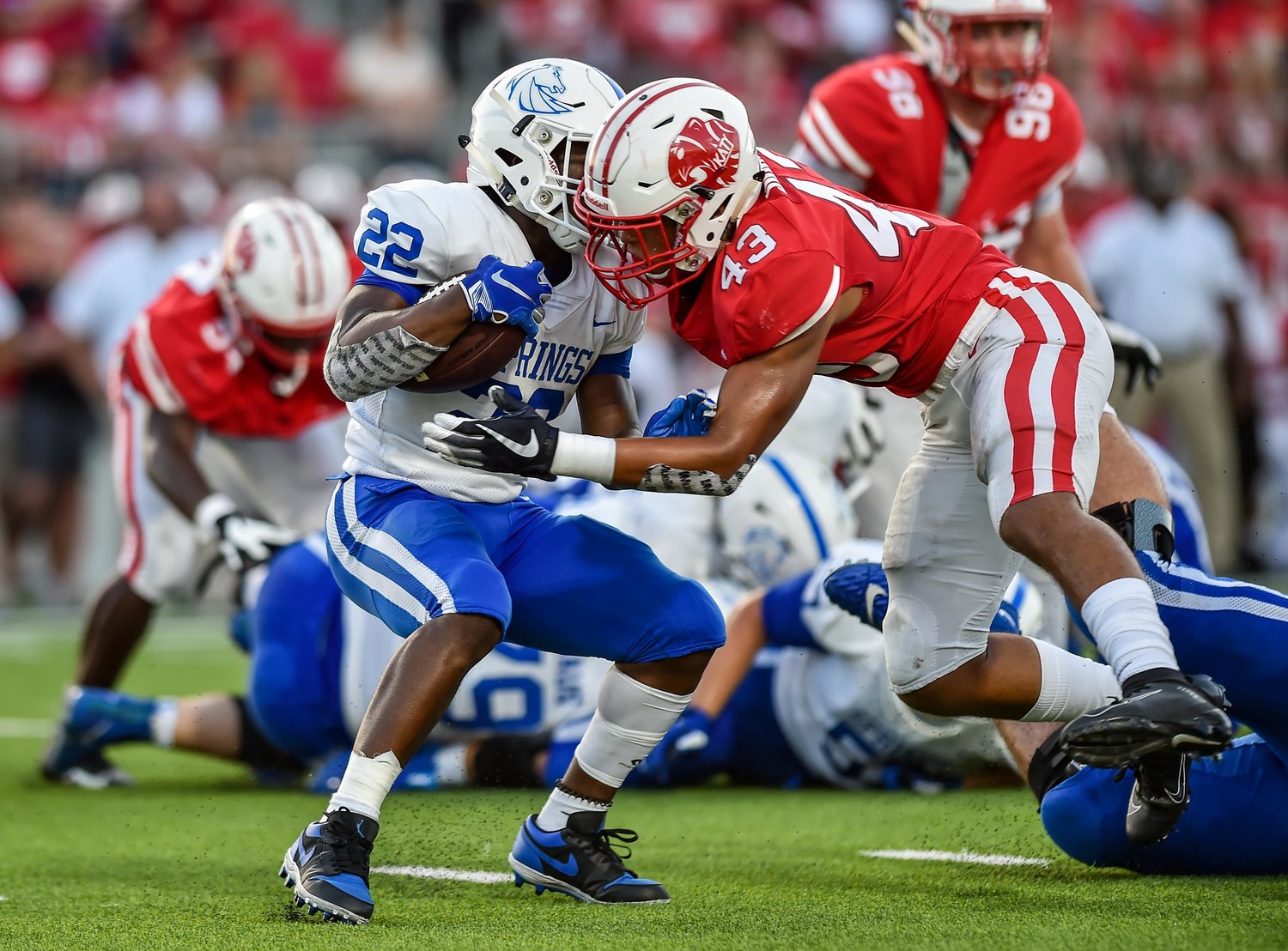 Katy, Tx. - Sept 21, 2019:  Katy's Dalton Johnson (43) makes the stop on Clear Springs Kaleb Hymes #22 during a game with Clear Springs at Legacy Stadium in Katy. (Photo by Mark Goodman / Katy Times)